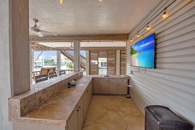 view of patio with ceiling fan