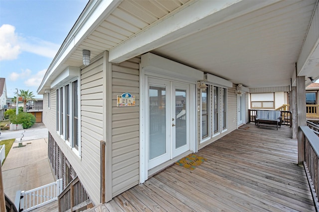 wooden deck featuring french doors