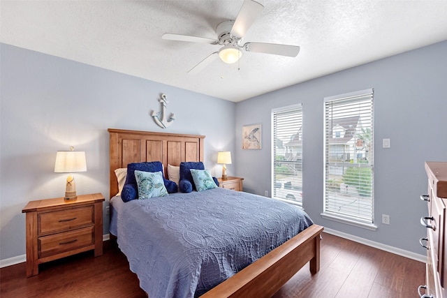 bedroom featuring ceiling fan and dark hardwood / wood-style flooring