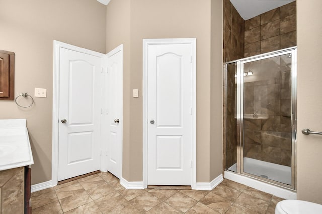 bathroom with vanity and a shower with shower door