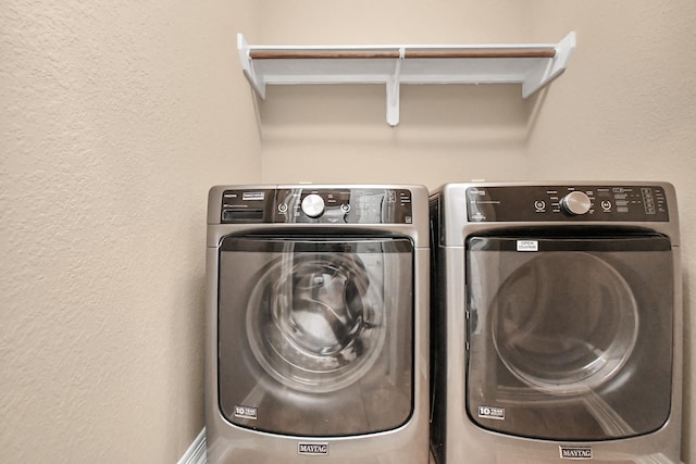 washroom featuring independent washer and dryer