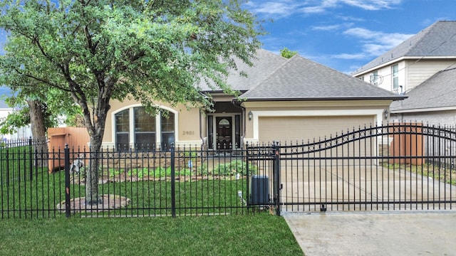 view of front of house with a garage and a front lawn