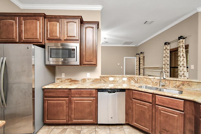 kitchen featuring light stone countertops, stainless steel appliances, sink, light tile patterned flooring, and crown molding