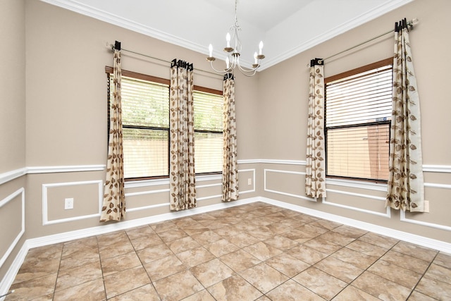 unfurnished room with an inviting chandelier, tile patterned flooring, and ornamental molding