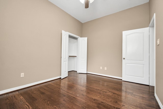 unfurnished bedroom featuring ceiling fan and dark hardwood / wood-style floors