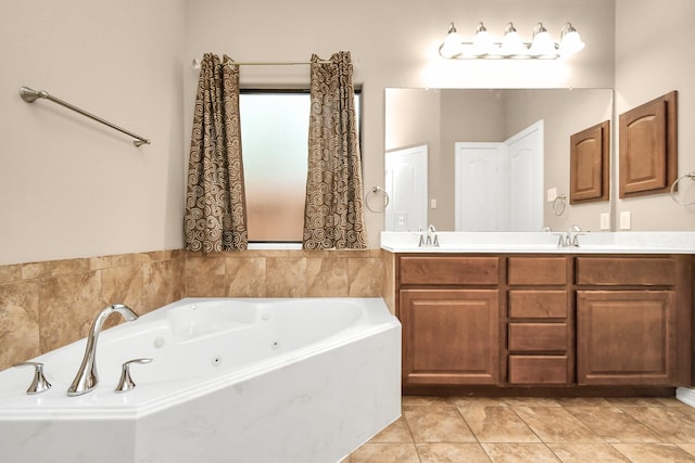 bathroom featuring a tub, tile patterned floors, and vanity