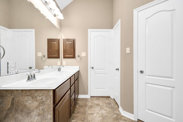 bathroom with vanity and tile patterned flooring