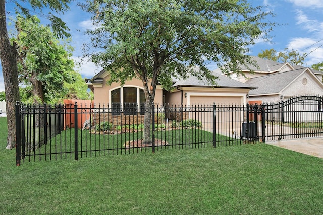 view of front of property with a garage and a front yard