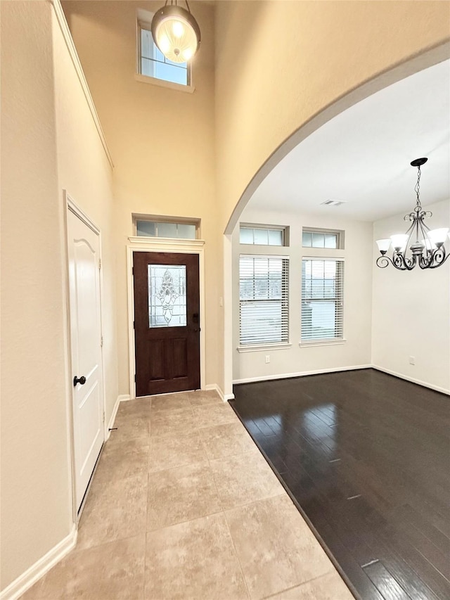 foyer featuring an inviting chandelier and hardwood / wood-style floors