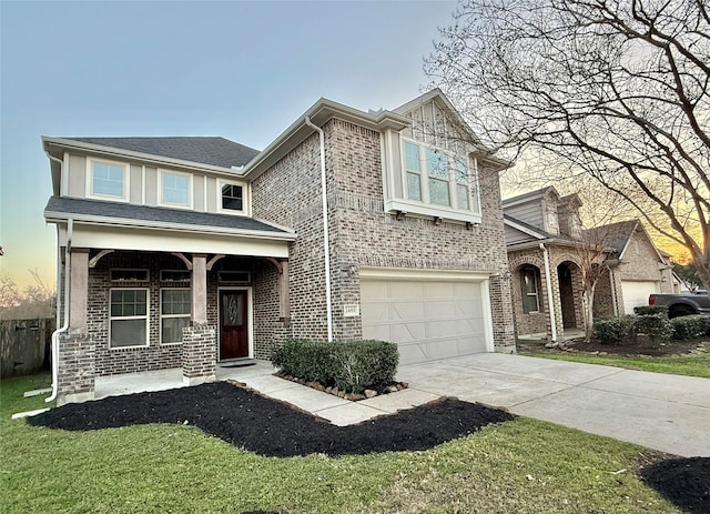 view of front of home with a garage, covered porch, and a front lawn