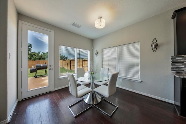 dining area featuring dark hardwood / wood-style flooring