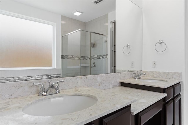 bathroom with walk in shower and vanity