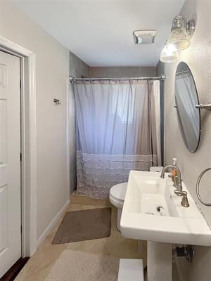 bathroom with sink, toilet, and walk in shower