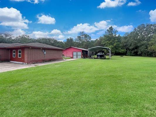 view of yard featuring a carport