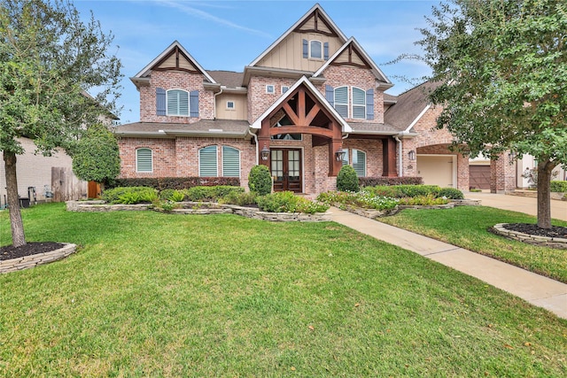 craftsman house featuring french doors, a garage, and a front lawn