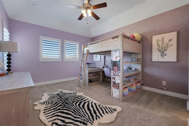 bedroom featuring vaulted ceiling, light carpet, and ceiling fan