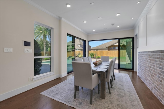 dining area featuring crown molding and dark hardwood / wood-style floors