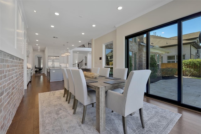 dining room with an inviting chandelier and light hardwood / wood-style flooring