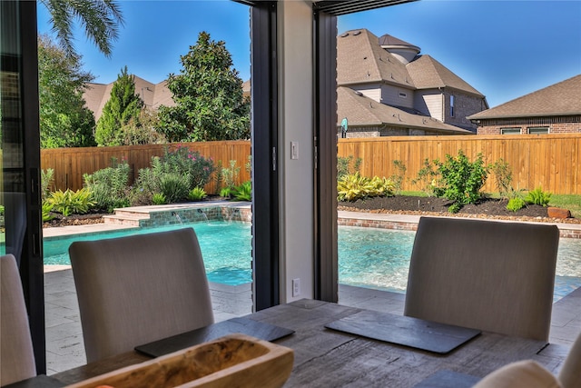 view of swimming pool featuring pool water feature