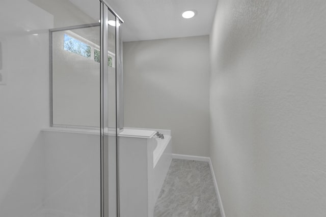 bathroom featuring plus walk in shower