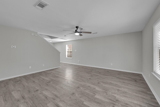 empty room featuring light wood-type flooring and ceiling fan