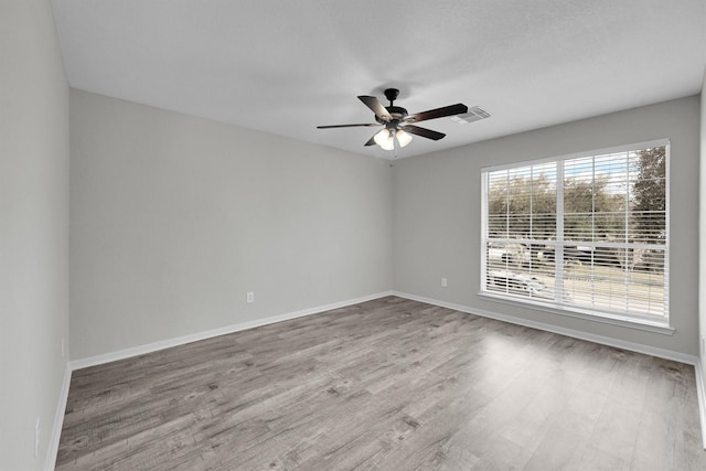 spare room featuring ceiling fan and wood-type flooring