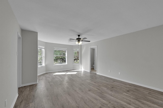 spare room featuring hardwood / wood-style flooring and ceiling fan