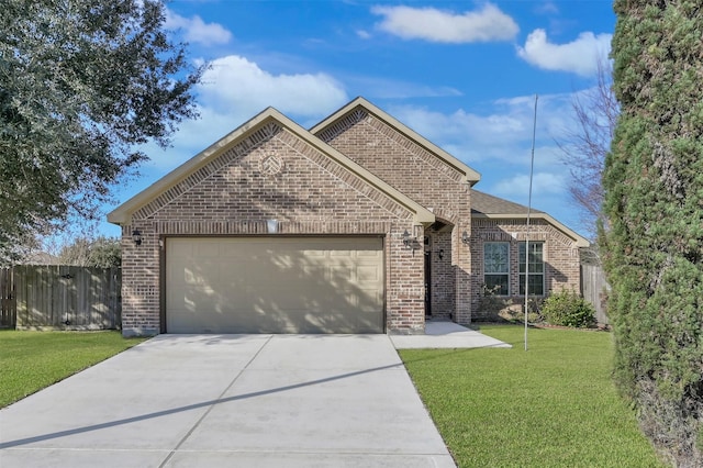 view of front of home with a garage and a front yard