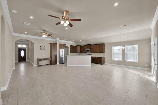 unfurnished living room featuring ornamental molding, ceiling fan with notable chandelier, and light tile patterned floors