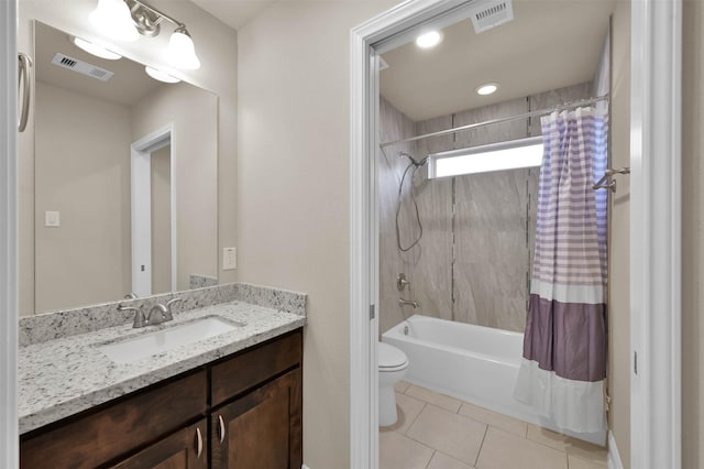 full bathroom with tile patterned floors, vanity, toilet, and shower / tub combo