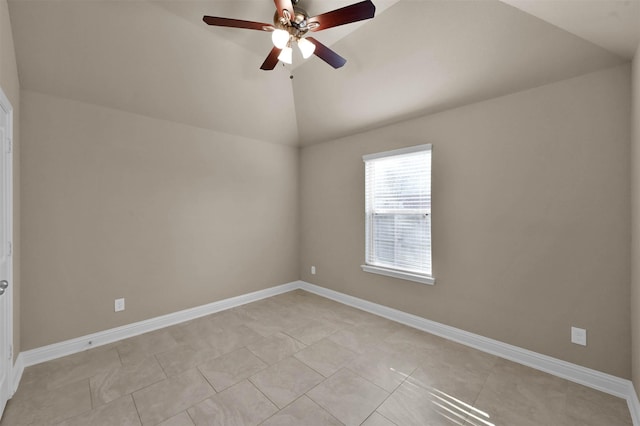 tiled empty room featuring ceiling fan and lofted ceiling