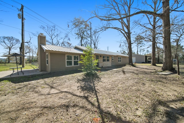 rear view of house with a patio area