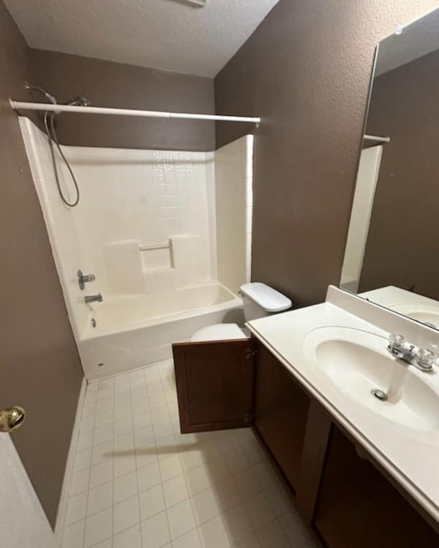 full bathroom with toilet, a textured ceiling, vanity, and bathing tub / shower combination