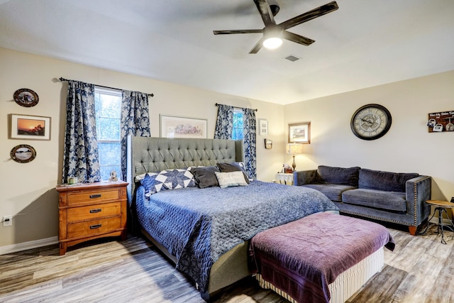 bedroom featuring ceiling fan and light hardwood / wood-style flooring