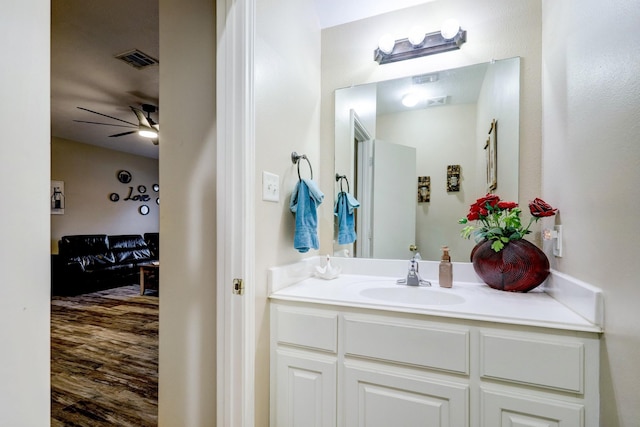 bathroom with ceiling fan and vanity