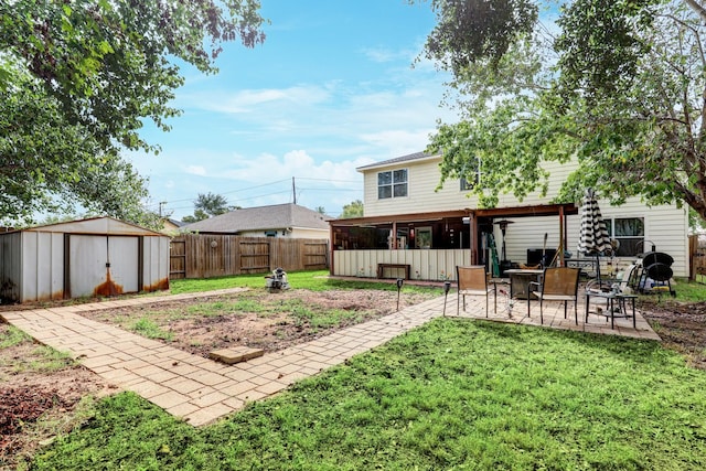 view of yard featuring a patio area and a shed