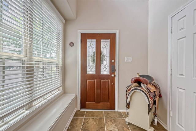 entrance foyer with light tile patterned floors