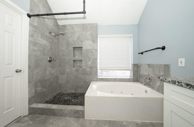 bathroom featuring shower with separate bathtub and vanity