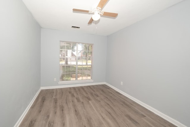 unfurnished room featuring ceiling fan and light hardwood / wood-style floors