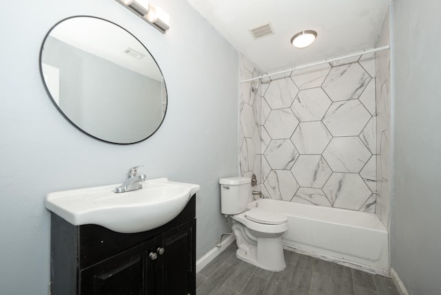 full bathroom featuring vanity, toilet, and tiled shower / bath combo