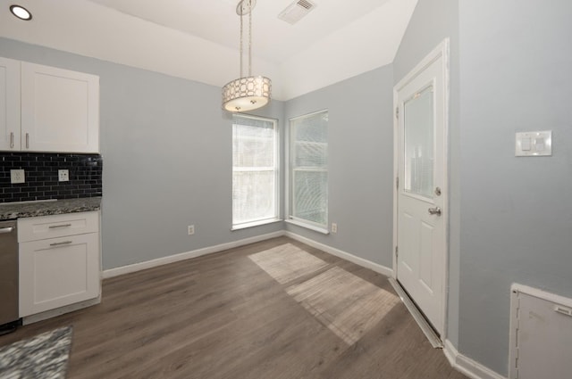 unfurnished dining area with dark hardwood / wood-style floors