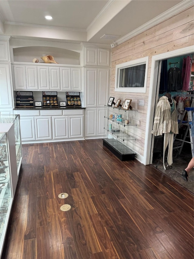 kitchen featuring crown molding, white cabinets, and dark hardwood / wood-style flooring