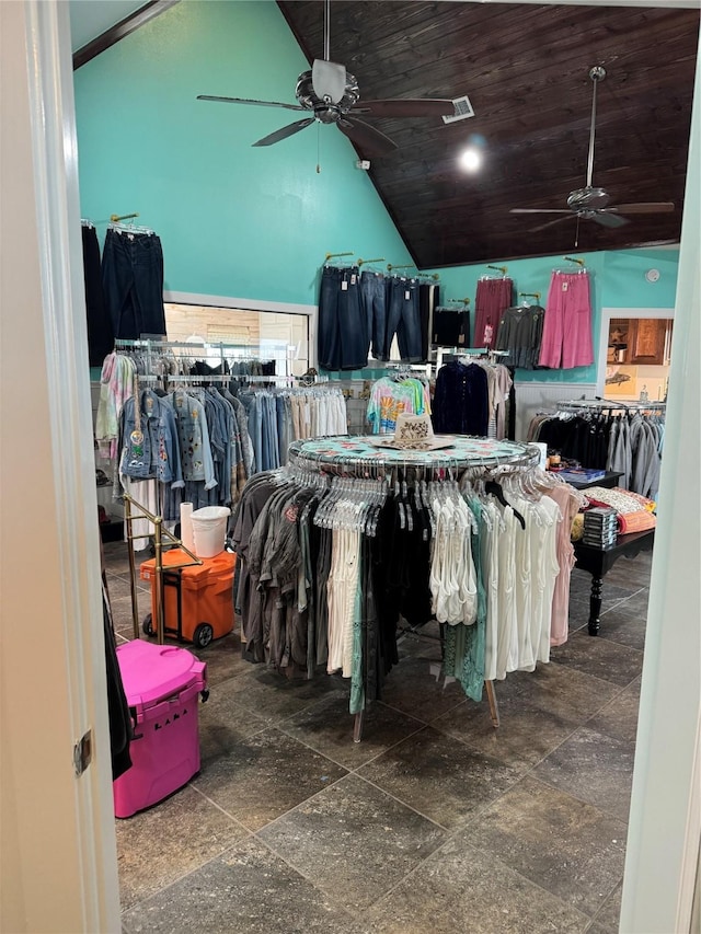 walk in closet featuring lofted ceiling and ceiling fan