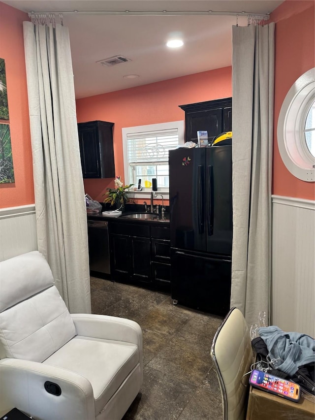 kitchen featuring sink and black appliances