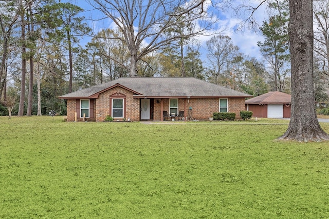 single story home featuring a garage and a front yard