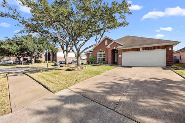 single story home featuring a garage and a front yard