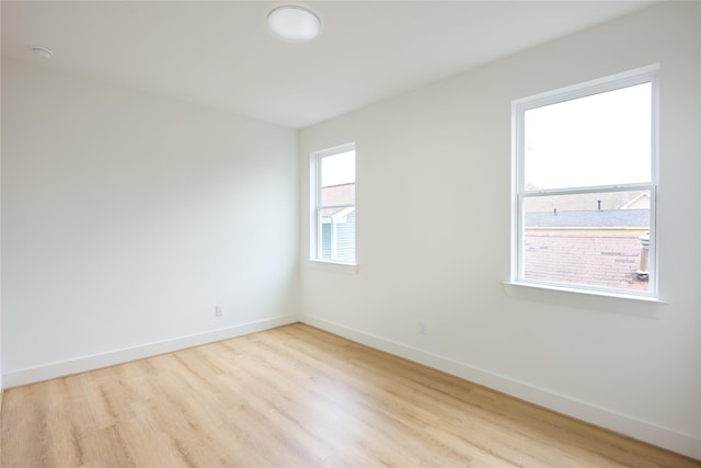 spare room featuring light hardwood / wood-style flooring