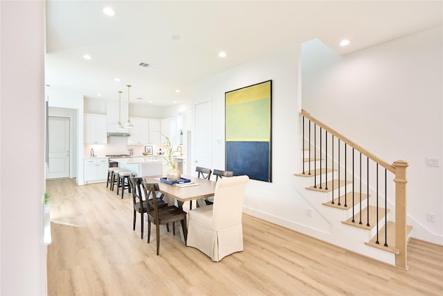 dining room featuring light wood-type flooring