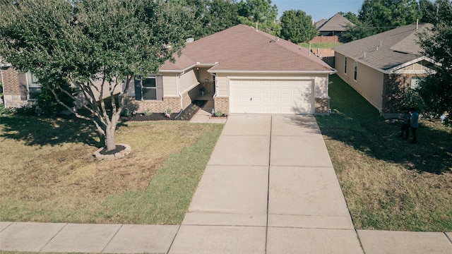 ranch-style home with a garage and a front lawn