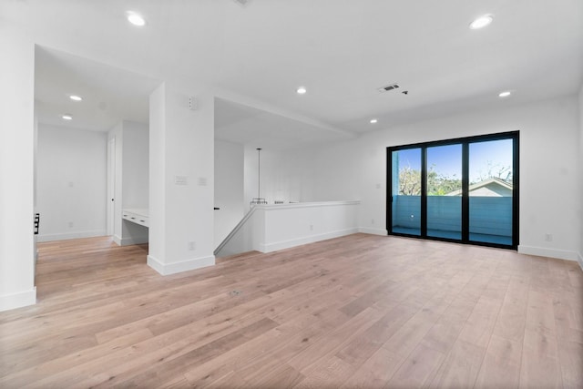 unfurnished living room featuring light hardwood / wood-style floors